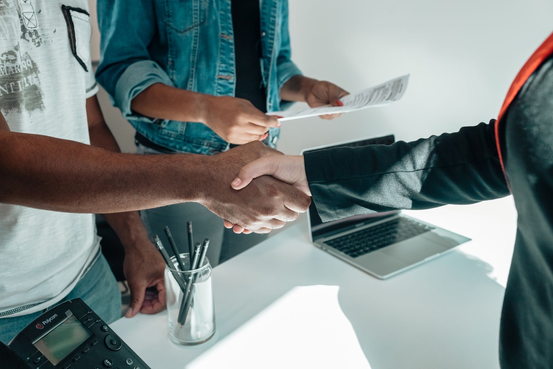 An advisor in conversation with a client across a table